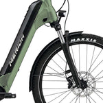 Merida eSPRESSO green ebike with suspension forks and integrated lights